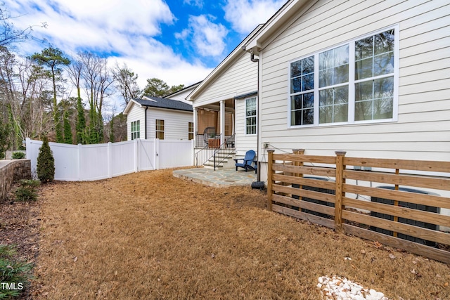 view of yard featuring a patio and fence