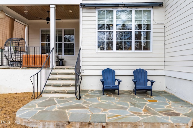 property entrance featuring a patio and a ceiling fan