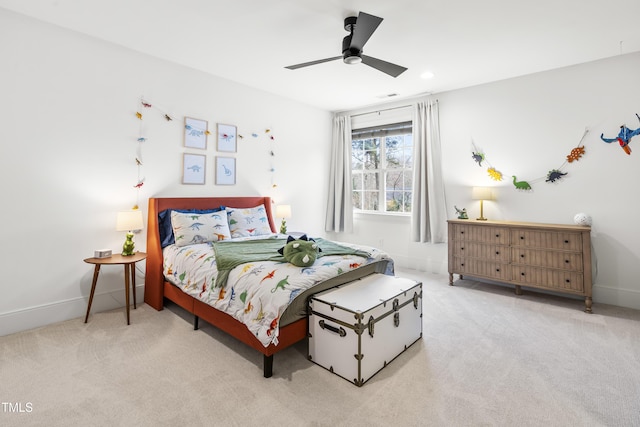 bedroom featuring baseboards, carpet floors, and a ceiling fan