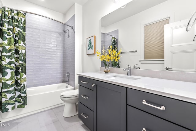 bathroom with vanity, toilet, shower / bath combo with shower curtain, and tile patterned flooring