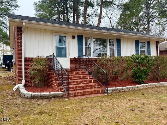 ranch-style house with brick siding