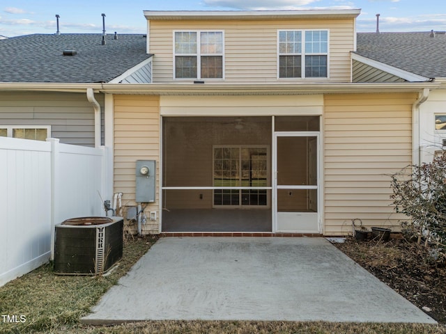 10133 Bessborough Dr, Raleigh, NC 27617 - rear view of house with a patio area, roof with shingles, cooling unit, fence, and a sunroom