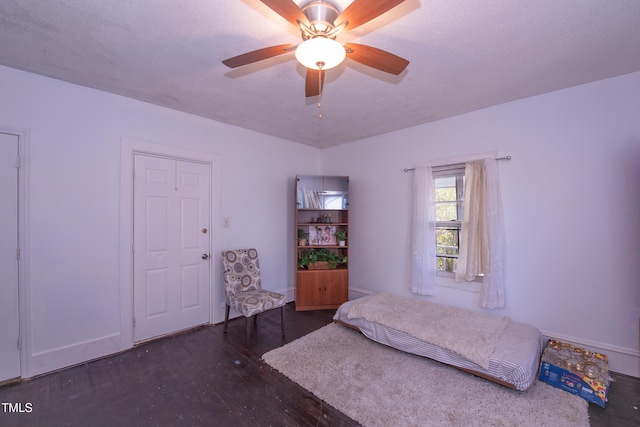 unfurnished bedroom featuring a ceiling fan and wood-type flooring