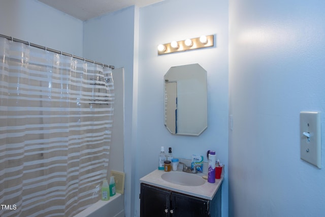 full bathroom featuring vanity and shower / bathtub combination with curtain