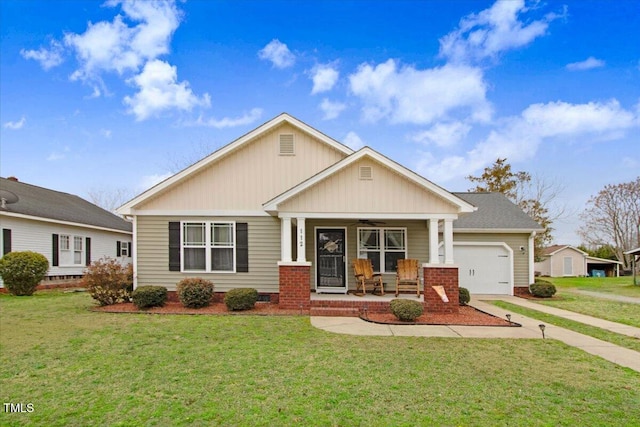 view of front of home featuring ceiling fan, an attached garage, covered porch, concrete driveway, and a front lawn