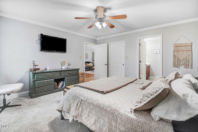 bedroom with baseboards, ceiling fan, ensuite bathroom, crown molding, and carpet flooring