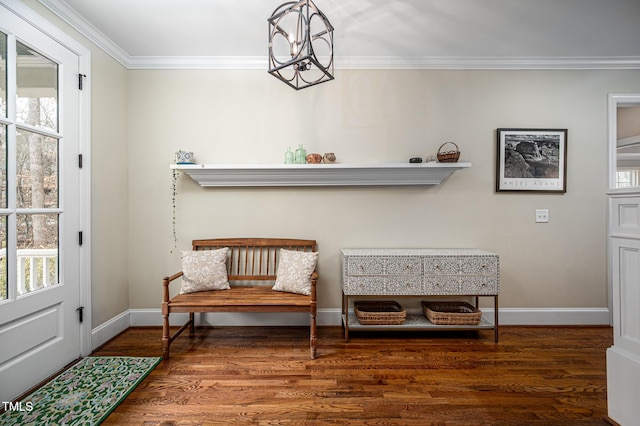 living area with ornamental molding, a wealth of natural light, a chandelier, and wood finished floors