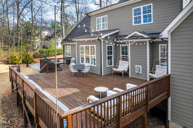 wooden terrace featuring outdoor dining area