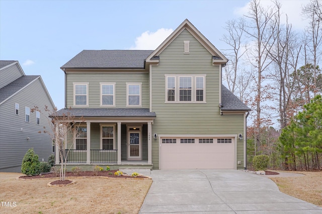 traditional-style home with driveway, covered porch, an attached garage, and a shingled roof