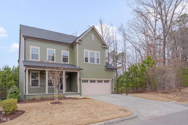 traditional-style house with covered porch, an attached garage, concrete driveway, and a shingled roof