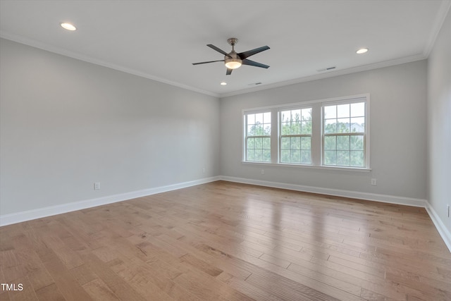 unfurnished room featuring crown molding, baseboards, visible vents, and light wood finished floors