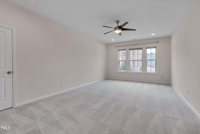 spare room with recessed lighting, baseboards, carpet, and ceiling fan