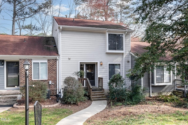 traditional-style house with brick siding