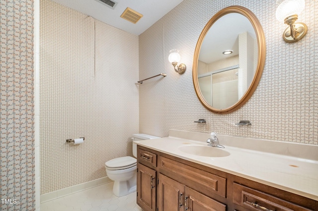 full bath featuring toilet, wallpapered walls, a shower with door, and tile patterned floors