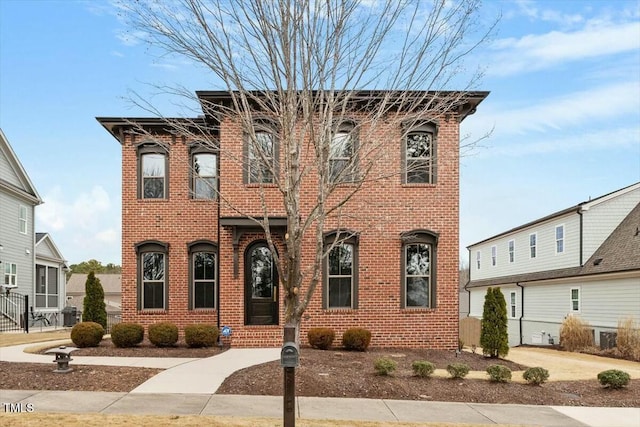 view of front of home featuring brick siding