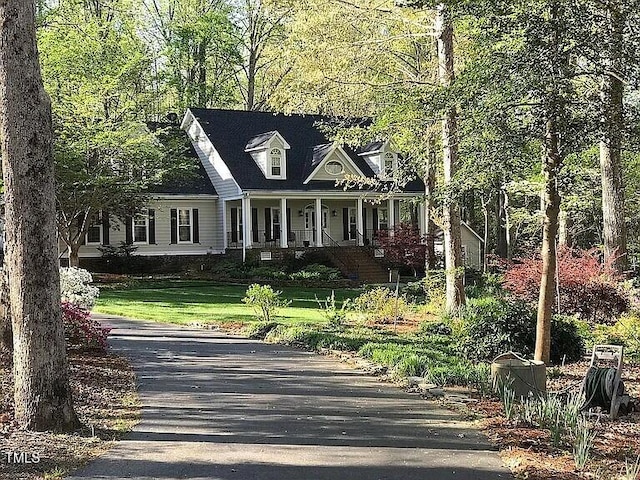1229 Westerham Dr, Wake Forest, NC 27587 - cape cod home featuring a porch