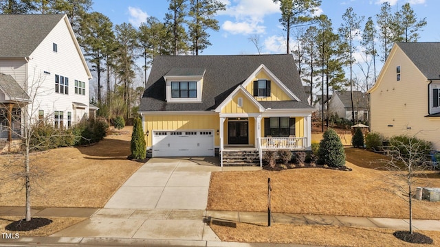 view of front of house featuring a porch, a garage, a shingled roof, driveway, and board and batten siding