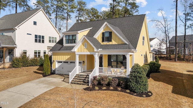 view of front of home featuring a porch, an attached garage, concrete driveway, roof with shingles, and board and batten siding