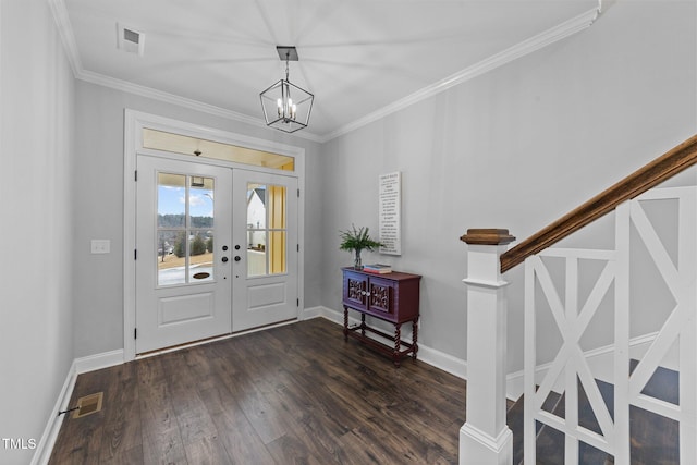 entryway featuring a chandelier, visible vents, french doors, dark wood-style floors, and crown molding