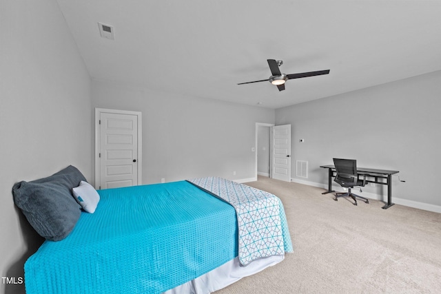 carpeted bedroom with a ceiling fan, visible vents, and baseboards