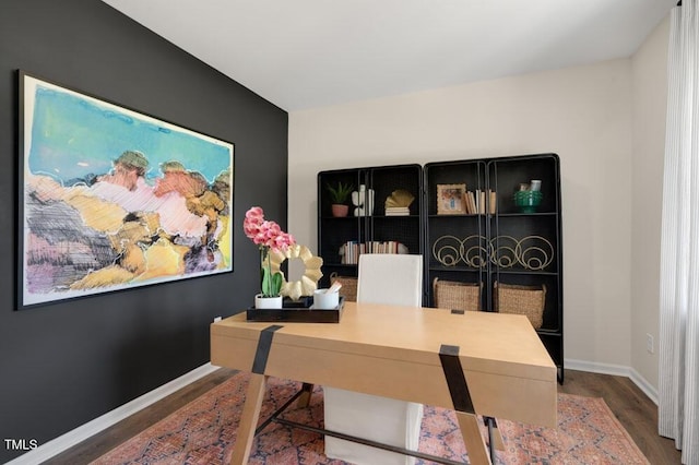 home office with wood finished floors and baseboards