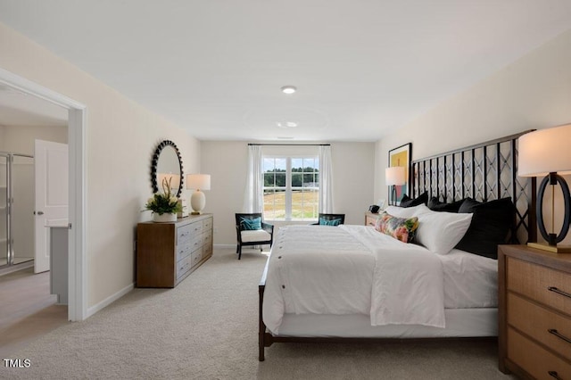 bedroom featuring light carpet and baseboards