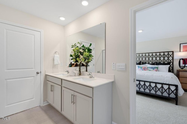 full bathroom featuring connected bathroom, recessed lighting, a sink, and double vanity