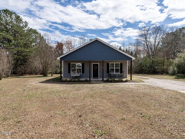 view of front of property featuring a front lawn and a porch