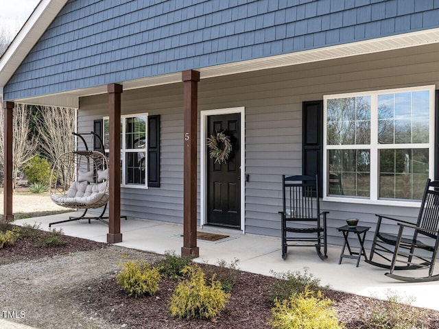 property entrance with covered porch