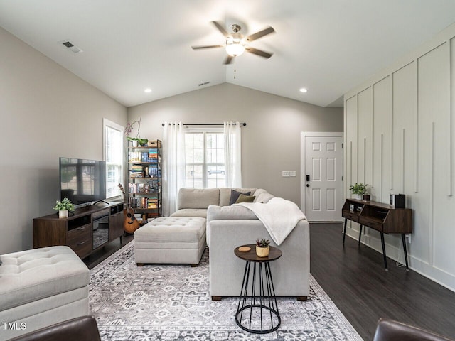 living area with visible vents, a ceiling fan, lofted ceiling, dark wood-style flooring, and recessed lighting