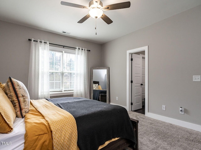 bedroom featuring baseboards, visible vents, ceiling fan, and carpet flooring