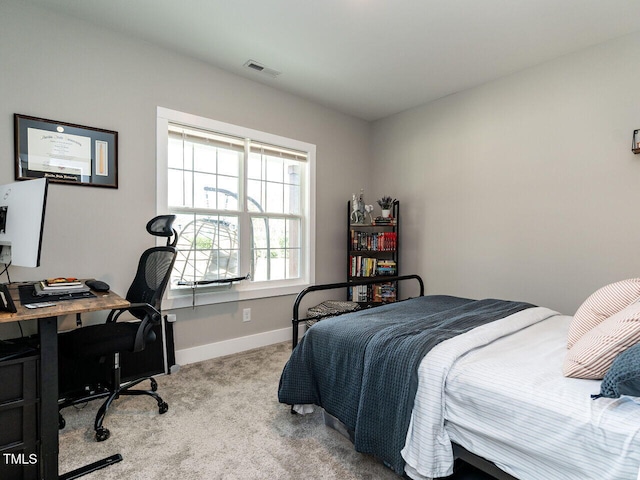 carpeted bedroom with visible vents and baseboards