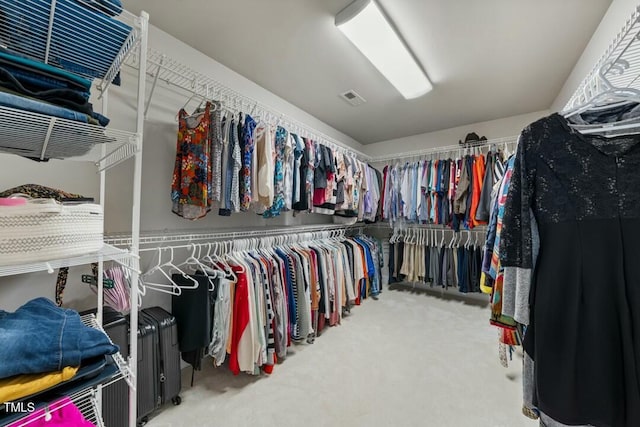 spacious closet with carpet floors and visible vents