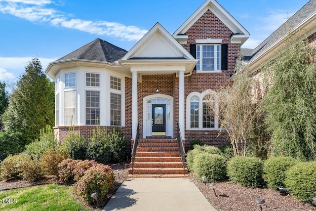 view of front of home featuring brick siding