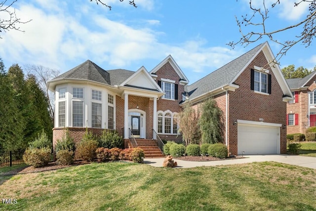 view of front of house with a garage, a front lawn, concrete driveway, and brick siding