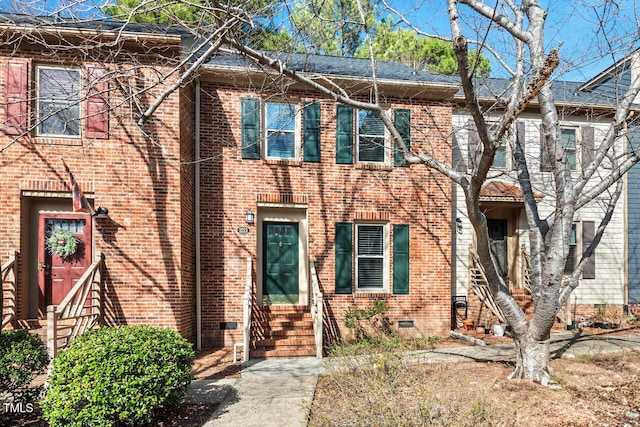 multi unit property with entry steps, crawl space, and brick siding