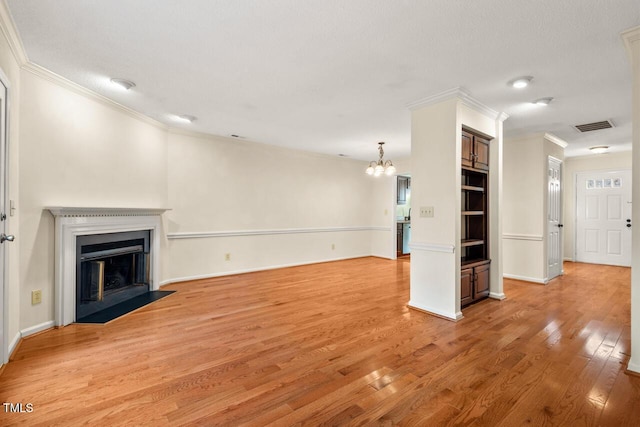 unfurnished living room with a fireplace, visible vents, light wood-style flooring, ornamental molding, and baseboards