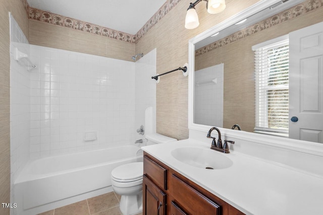 bathroom with tile patterned flooring, shower / bathing tub combination, vanity, and toilet