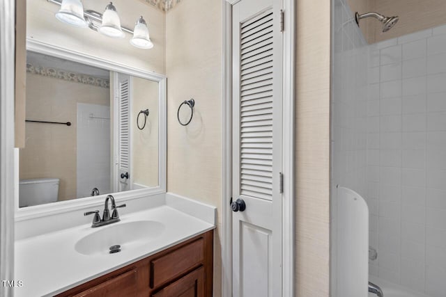 full bath with toilet, shower / bathing tub combination, a closet, and vanity