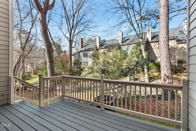 wooden terrace featuring a residential view