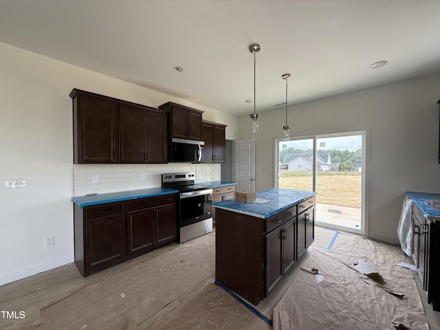 394 Springtooth Dr, Zebulon, NC 27597 - kitchen with appliances with stainless steel finishes, decorative backsplash, dark brown cabinetry, and a center island