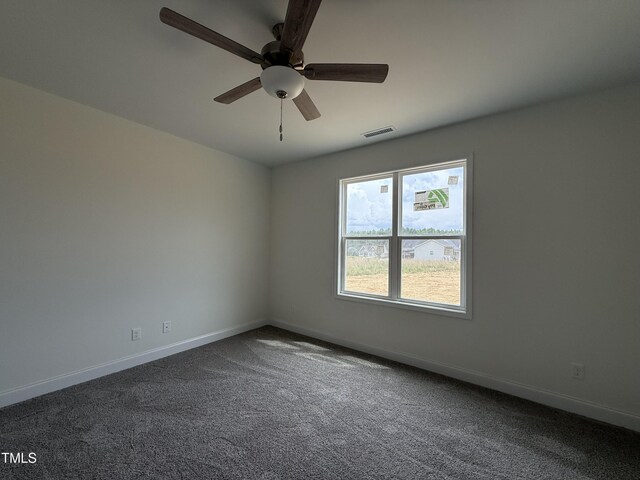 394 Springtooth Dr, Zebulon, NC 27597 - unfurnished room featuring dark colored carpet and ceiling fan