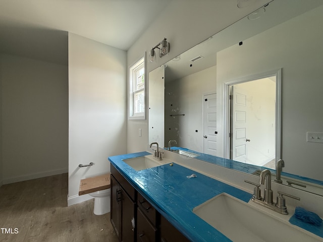 394 Springtooth Dr, Zebulon, NC 27597 - bathroom with wood finished floors and double vanity