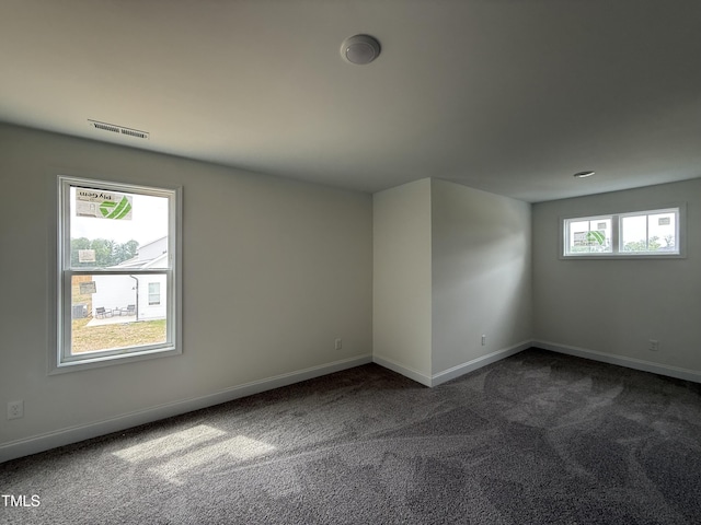 394 Springtooth Dr, Zebulon, NC 27597 - spare room featuring carpet floors and baseboards