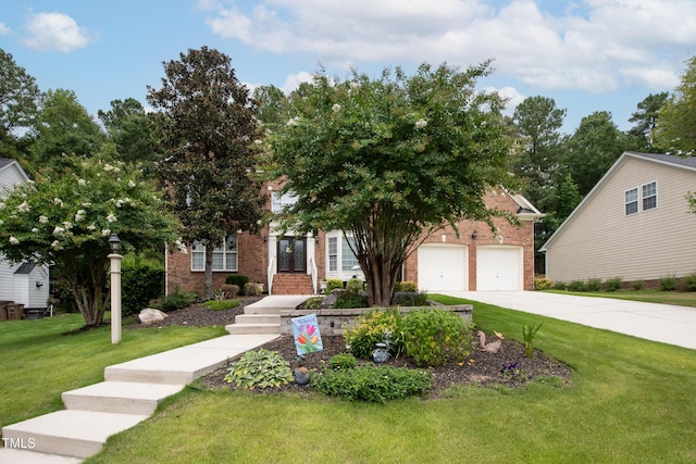 view of property hidden behind natural elements featuring a garage, driveway, brick siding, and a front lawn