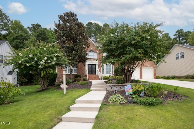 view of front of property featuring a garage, brick siding, concrete driveway, french doors, and a front yard