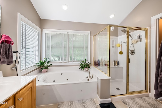 full bathroom with a healthy amount of sunlight, a shower stall, a whirlpool tub, and vanity