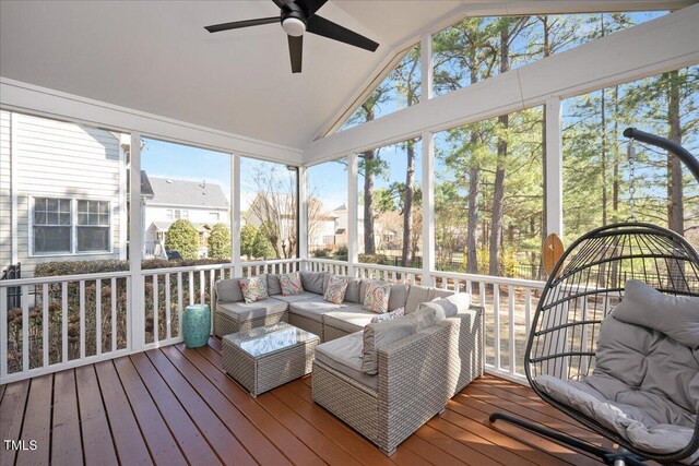 sunroom / solarium with vaulted ceiling and a ceiling fan