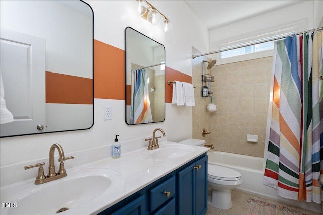 bathroom with a sink, shower / tub combo with curtain, double vanity, and toilet