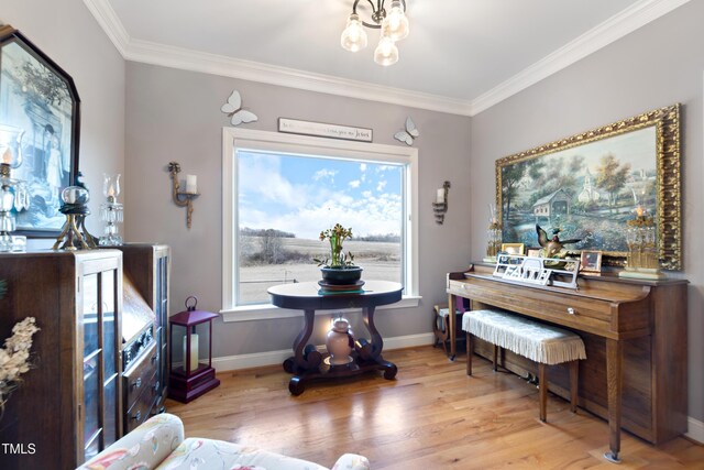 5204 Sandbridge Rd, Bailey, NC 27807 - living area featuring ornamental molding, wood finished floors, a chandelier, and baseboards